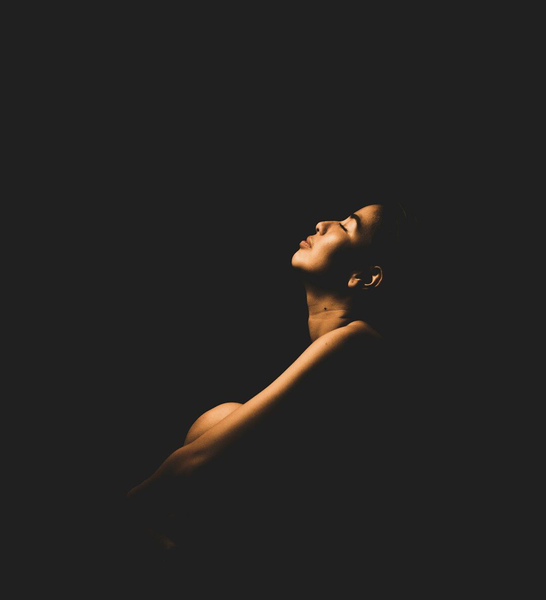 Person meditating peacefully with eyes closed
