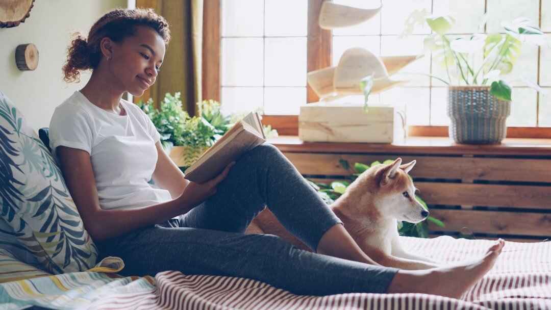 person reading book at home