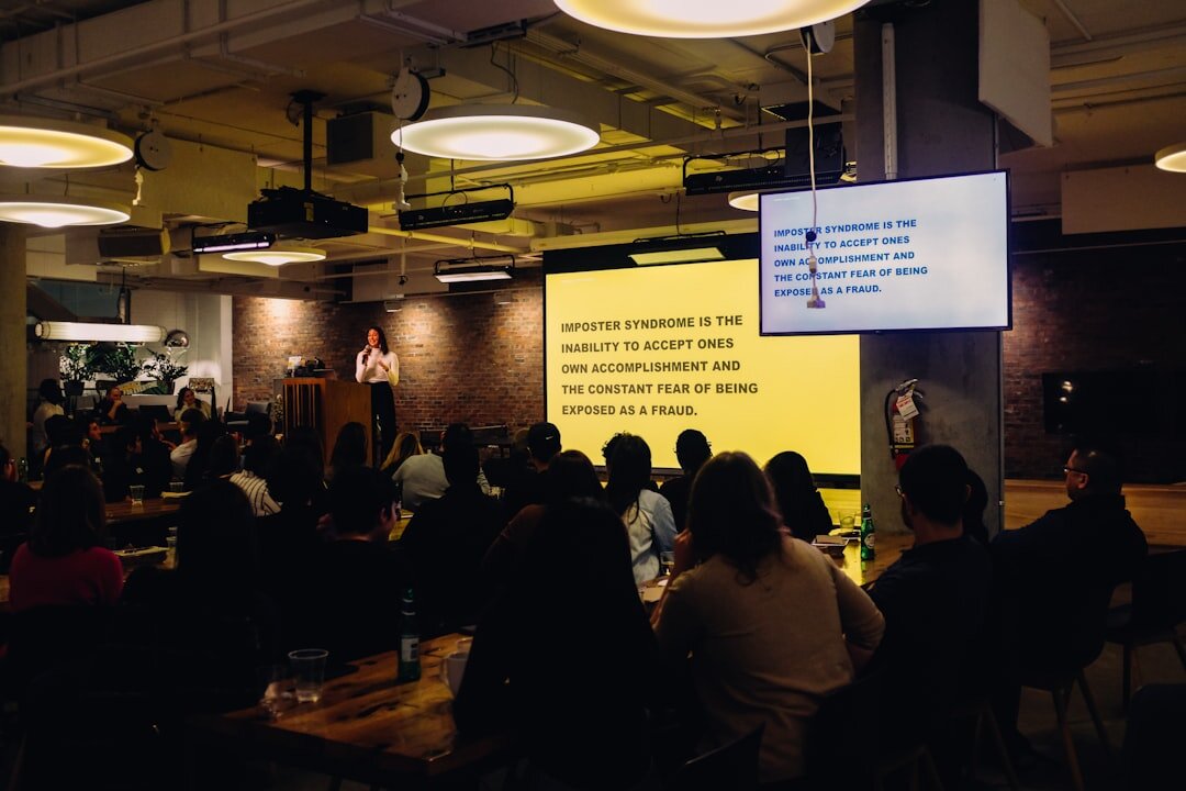 person giving presentation to audience