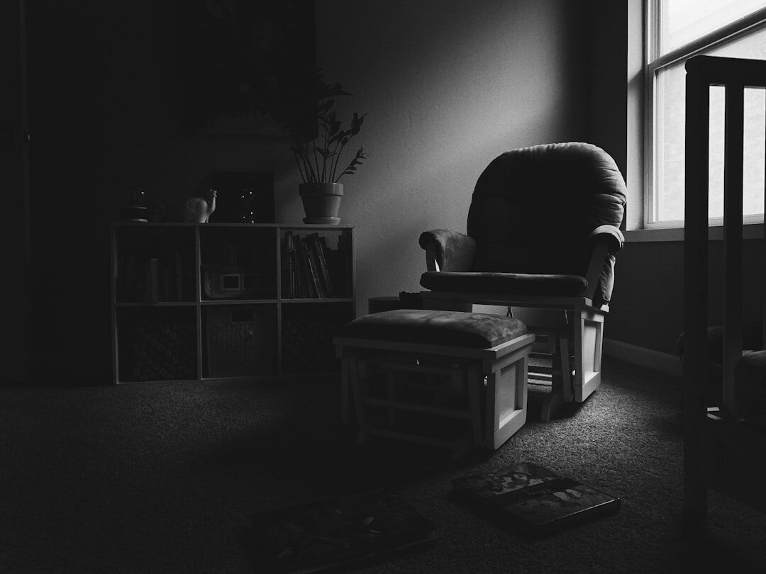 person reading book in quiet room